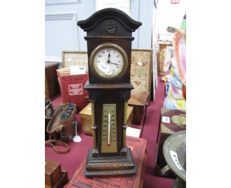 A Miniature Oak Cased Longcased Clock, with brass pilasters and thermometer, on bun feet, labelled " X L British Manufacture"