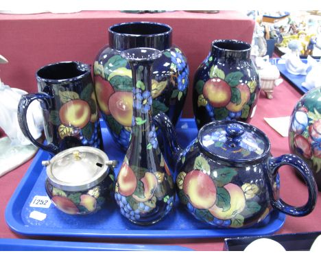 A Collection of Early XX Century Stanley Jacobean Ware, painted in the Peach, Grape and Forget-me-not pattern on a deep blue 