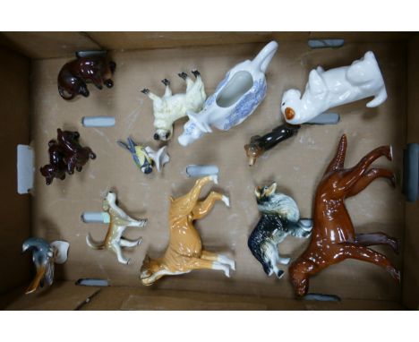 A collection of Goebel &amp; similar pottery dog figures including Boxers, Dachshunds, Labrador, Birds etc 