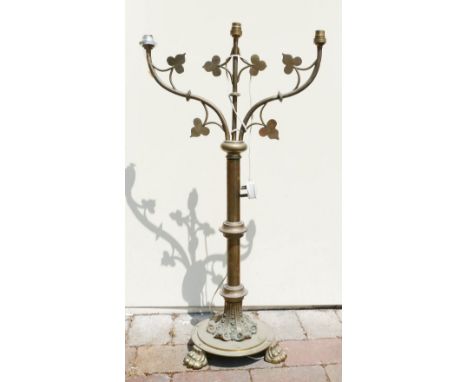 Brass ecclesiastic lamp with three light fittings. ivy decoration , lion claw feet and volute decoration to base 