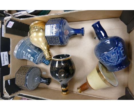 A collection of Wade Whisky &amp; Spirt Decanters to include Bells Glenfiddich , Chivas .  These items were removed from the 