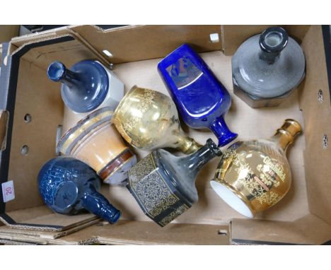 A collection of Wade Whisky &amp; Spirt Decanters to include Bells, Glenfiddich , Chivas .  These items were removed from the
