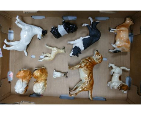 A collection of Goebel &amp; similar pottery dog figures including Jack Russell, Pekingese, Labrador, Greyhound etc 