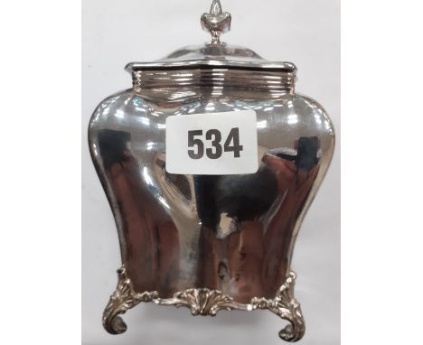 A SILVER FRENCH STYLE TEA CADDY WITH SHAPED BODY ON SCROLLED FEET 7" HIGH SHEFFIELD 1909 APPROX 6.3 OZ