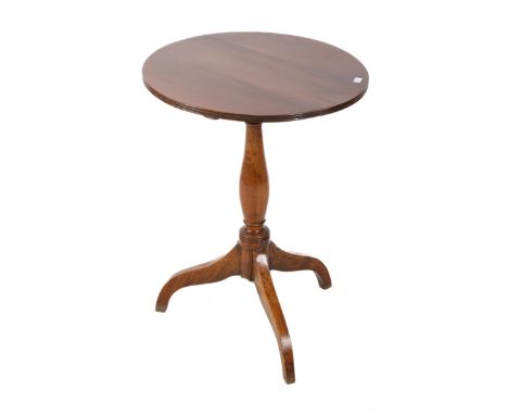A Victorian tilt top mahogany table. The circular top mounted on a turned column with a tripod base, H69.5cm x diameter 51cm