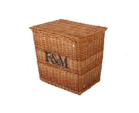 A large vintage Fortnum and Mason basket. Of tapered rectangular form, having a hinged lid and side handles, sprayed 'F&M' to
