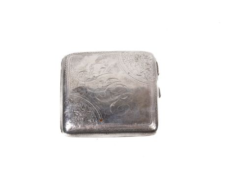 An early 20th century silver cigarette case. Of slightly curved form, engraved to two corners with scrolling leaves, central 