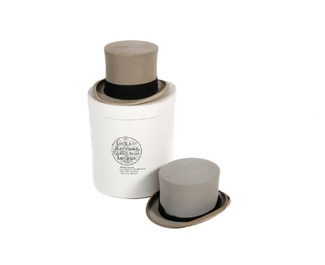 Two vintage gentleman's top hats. Constructed of grey felt with leather and fabric linings, one by Lock & Co, inner circumfer