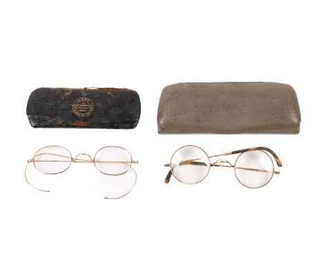 Two pairs of vintage gold plated spectacles. In lined leather cases