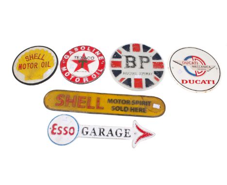 A collection of six reproduction petroliana and automobilia advertising metal signs. Including 'Esso Garage', 'Shell' and 'Du