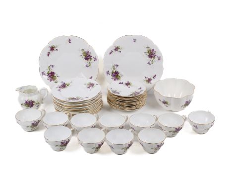 A 20th century Foley porcelain tea service. Decorated with violets and having gilt rims, comprising eleven cups and saucers, 