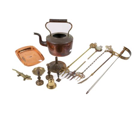 An assortment of Victorian metalware. Including a copper tray, an Indian brass tray with engraved details, a copper kettle, e