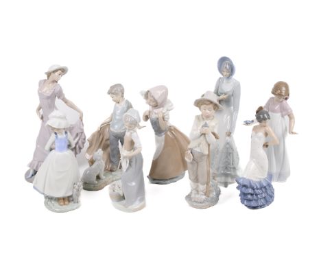 Nine Nao ceramic figures. Modelled as a shepherdess, a woman holding a basket of flowers, a boy holding a bird, etc. Max. H32