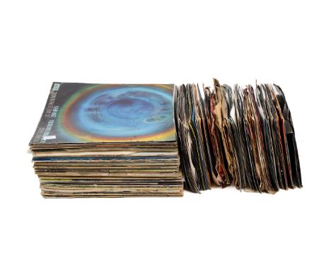 A collection of vintage vinyl records. Including Elvis Presley, Eagles, etc, the majority in the original sleeves