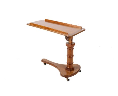 A Victorian adjustable wooden bed tray ready stand. With rectangular top, turned pedestal support terminating on a shaped bas