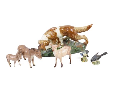 A collection of five Beswick animals and a ceramic gun dog. Including two donkeys, two birds and a deer, etc. Max. H17cm