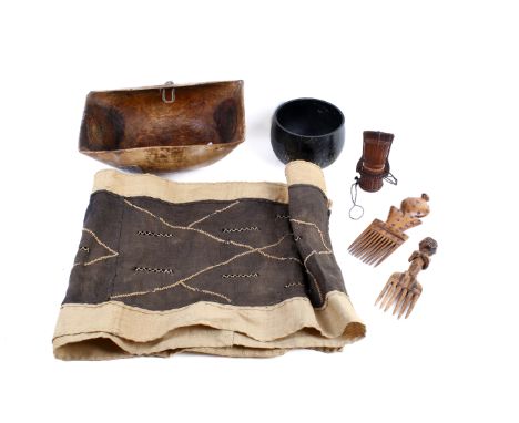 A group of six assorted African tribal artifacts. Including two carved wooden combs, a metal bowl and a tablecloth, etc. Max.