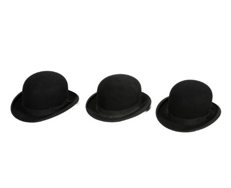 Six vintage black bowler and top hats. Comprising a Litewear hat with a brown leather rim, internal measurement 55cm, a 'The 