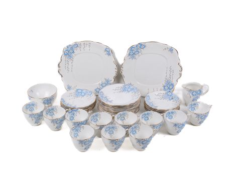 A vintage Roslyn porcelain tea service in the 'Malva' pattern. Comprising eleven cups, twelve saucers, a sugar bowl, cream ju