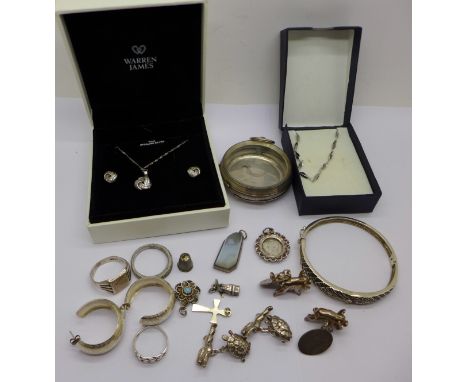 Assorted silver jewellery including pig cufflinks and hare and the tortoise novelty cufflinks, charms and a silver watch case