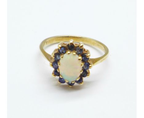 A 9ct gold, opal and sapphire ring, 2.6g, O