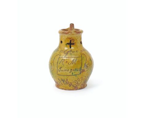 A good Donyatt slipware puzzle jug  dated 1834, the globular body incised with stylized tulips beneath the motto 'Now drink o
