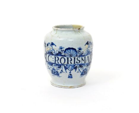 A delftware dry drug jar  2nd half 18th century, painted in blue with two putti holding flower stems above a banner surmounte