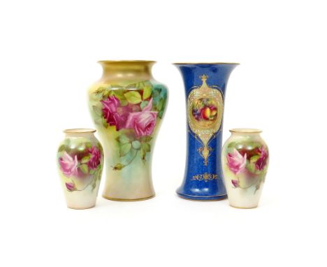 Four Royal Worcester vases  c.1930 and earlier, a small pair of vases and a large baluster vase decorated with large rose spr