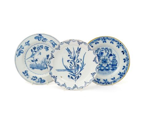 Two delftware plates  18th century, variously painted in blue, each with a bird perched on a leafy branch, one with floral sp