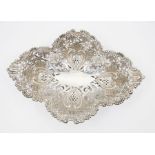 A late Victorian silver shaped quatrefoil reticulated bowl, border cast with flowers above scrolling