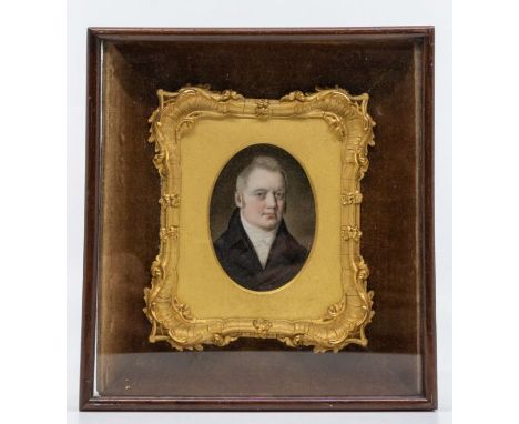 An early 19th Century miniature portrait of a Gentleman, white stock with black coat, lapels heightened, oil on card, 7cm x 5
