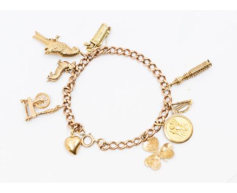 A 9ct gold  charm bracelet comprising a rose gold Albert link bracelet suspended with various 9ct gold and yellow metal charm