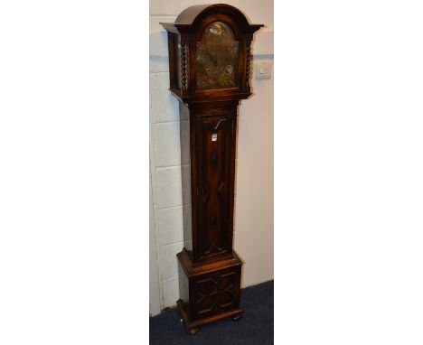 An oak granddaughter clock by Tempus Fugit, the hood with glazed door enclosing brass dial, decorated with mask spandrels, 16