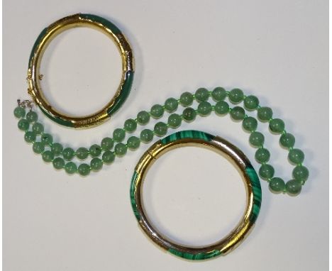 A string of green jade style beads, 50cm long unfastened, together with a green jade style bangle with gold plated mounts and