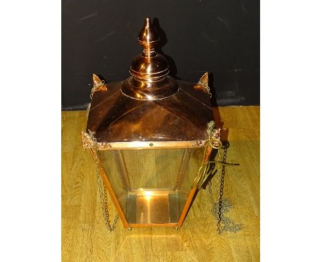 **A large Victorian copper street lamp, converted to a ceiling light, of square tapering form, with finial to top and shell s