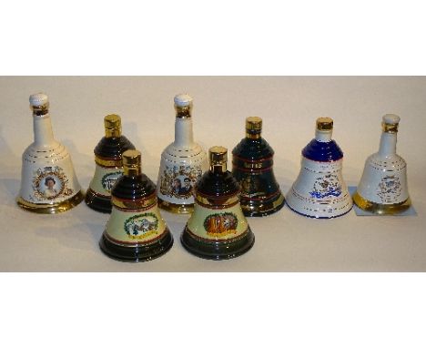 Eight assorted Wade Bell's whisky decanters, with contents, four boxed and four in tins