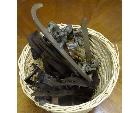 Four pairs of vintage iceskates, that tie on to original footware, one named 'Mitchells Caledonia' another named 'Styria Olym
