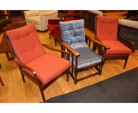 A pair of vintage Parker Knoll armchairs, 86cm high, also with a vintage oak reclining armchair, 110cm high (3)