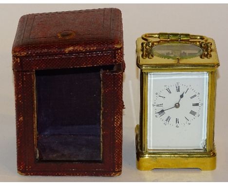 An antique repeating carriage clock, the white enamel dial with Roman and Arabic numerals, with glazed open top, back and sid