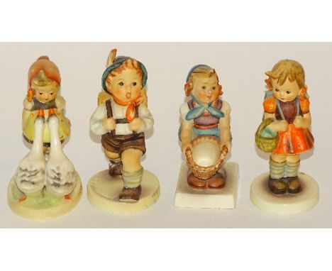 Four Hummel figures by Goebel, 12cm high (4)   CONDITION REPORT:  Lot 104 - boy with backpack has repair to foot and broken f