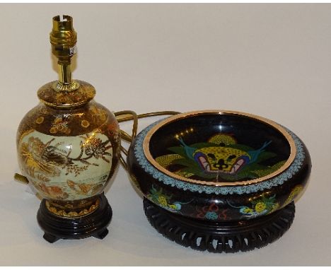 A Chinese cloisonne bowl on hardwood stand, circa early 20th century, decorated with colourful panels of dragons, 19cm diamet