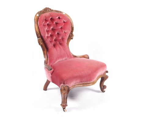 A Victorian walnut button back upholstered serpentine fronted chair with light red velvet covering. 93.5 cm high