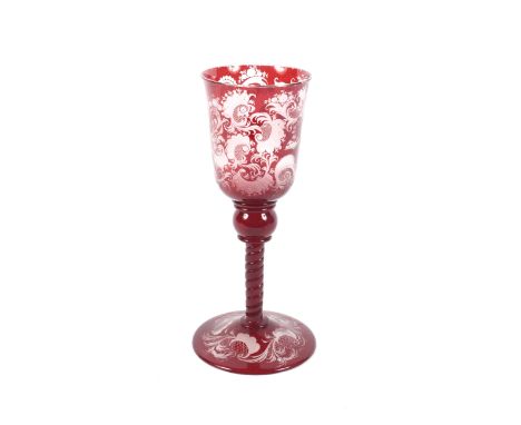 An early 19th century Bohemian ruby cased engraved glass goblet. Decorated with hunting scenes, 22.3 cm H