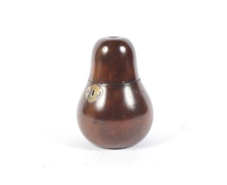 A pear wood tea caddy of pear shape with white metal shaped escutcheon. 15.9 cm high (AF)