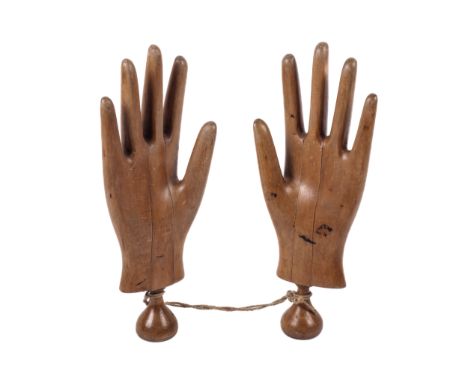 A pair of beech shop glove display/mannequin hands. Each with a through section, 31cm high Condition Report: CRNo splits or a