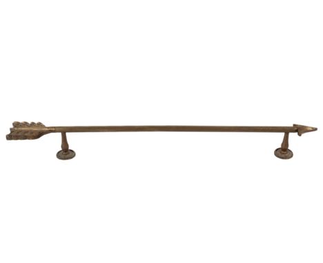 A 19th century brass 'arrow' door handle (although could be used for a rail). With decorative roundels and vase shaped suppor
