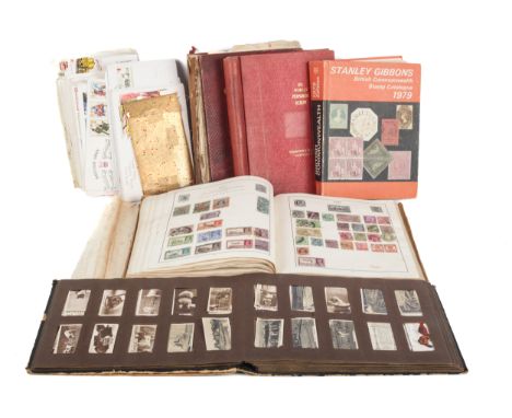 A collection of stamp albums, First Day covers and a cigarette card album 