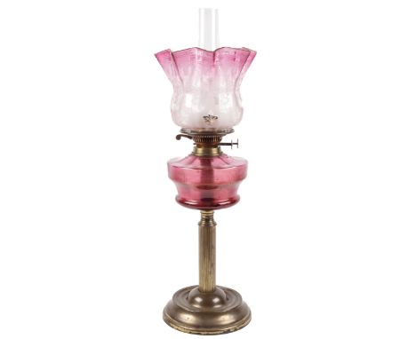 A 19th century cranberry and brass oil lamp. With twin Duplex burner, acid etched shade with a frilled rim, H65cm Condition R