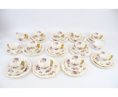 A 1931 Aynsley Art Deco ceramic partial tea service. Comprising 11 side plates, 12 cups, 6 saucers, 6 breakfast plates, a mil