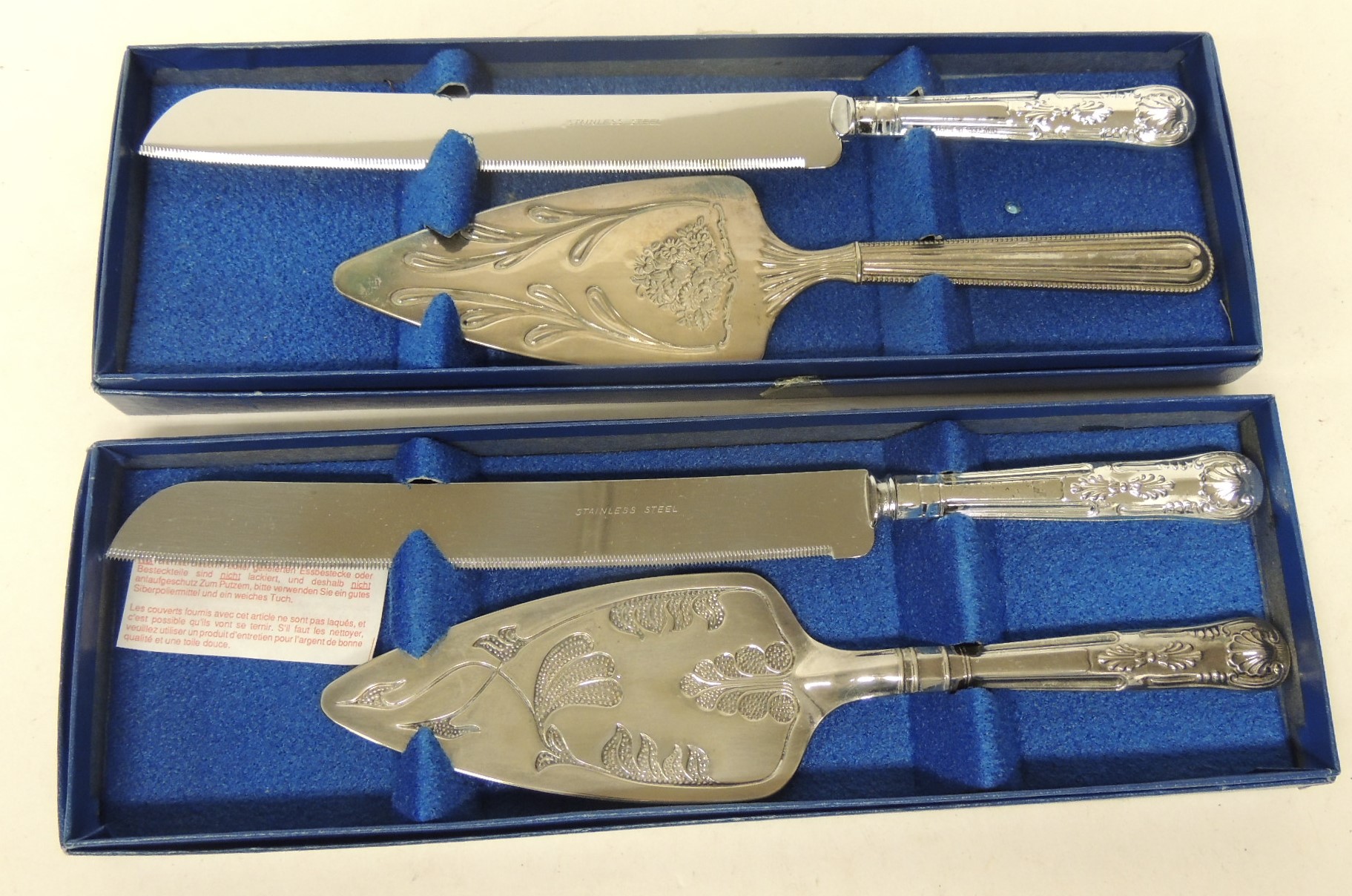 Two "Queen Anne" boxed silver plated cake slice/bread knife sets